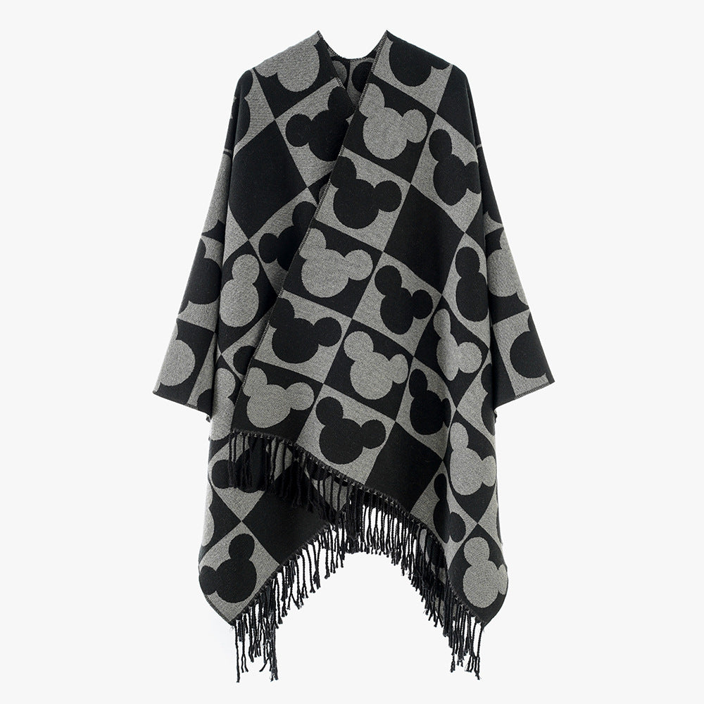 Damen Oversize-Jacquardponcho mit grafischem Kopf-Silhouettenmuster und Fransen – Avérine