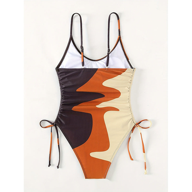 Damen Einteiler Badeanzug mit asymmetrischem Muster und verstellbarem Bindeband Echo Archiv