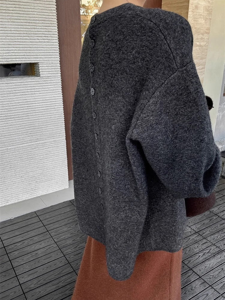 Damen Oversize-Feinstrickpullover mit Ballonärmeln und Knopfmanschette Echoarchiv