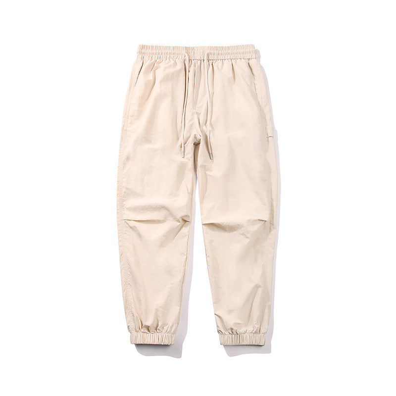 Herren Nylon-Mix Relaxed-Jogger mit elastischem Komfortbund, verdeckten Reißverschlusstaschen und geripptem Knöchelabschluss Echo Archiv