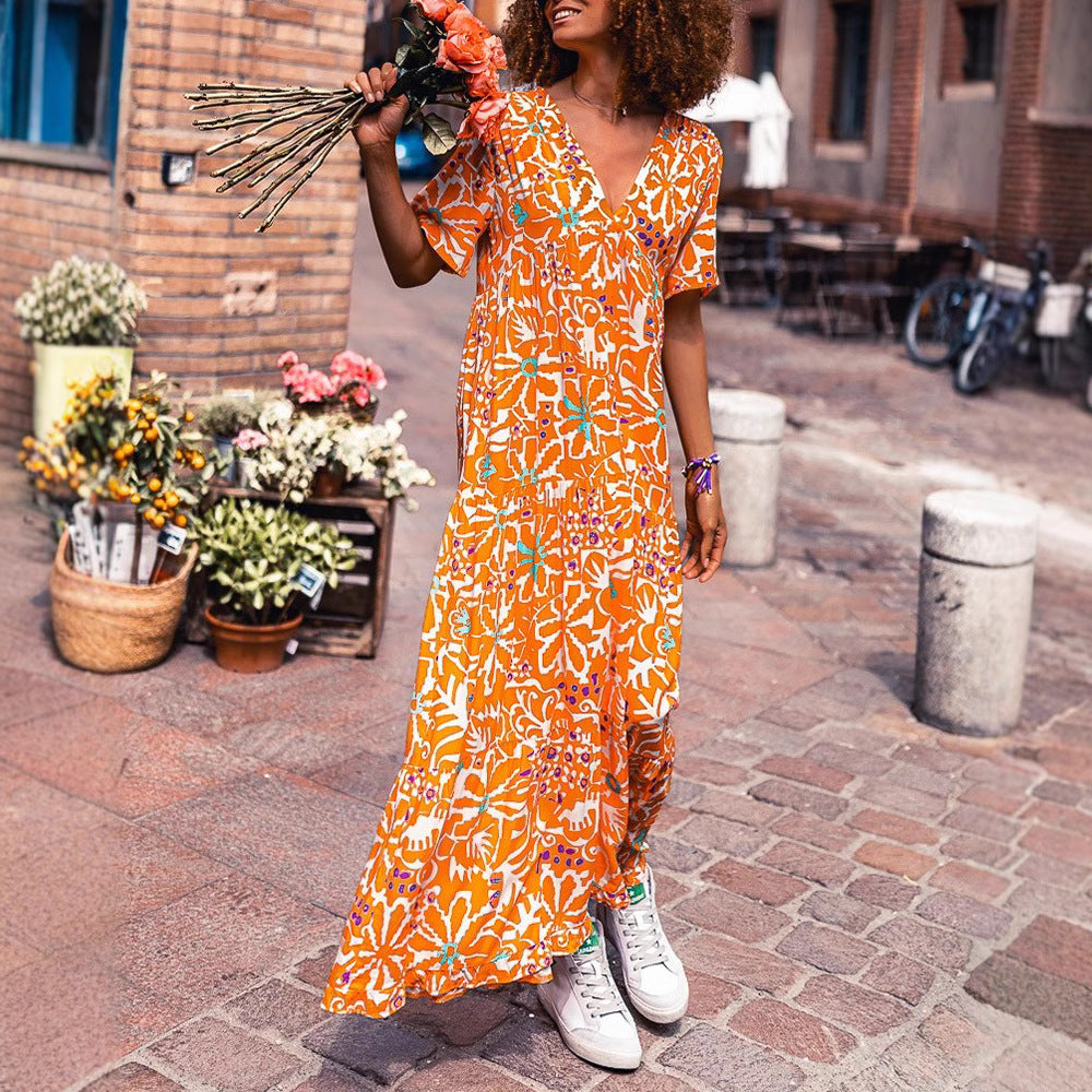 Damen nan knöchellanges V-Ausschnitt-Maxikleid mit grafischem Ethno-Print, kurzen Ärmeln und schwingender Volantbahn Echo Archiv