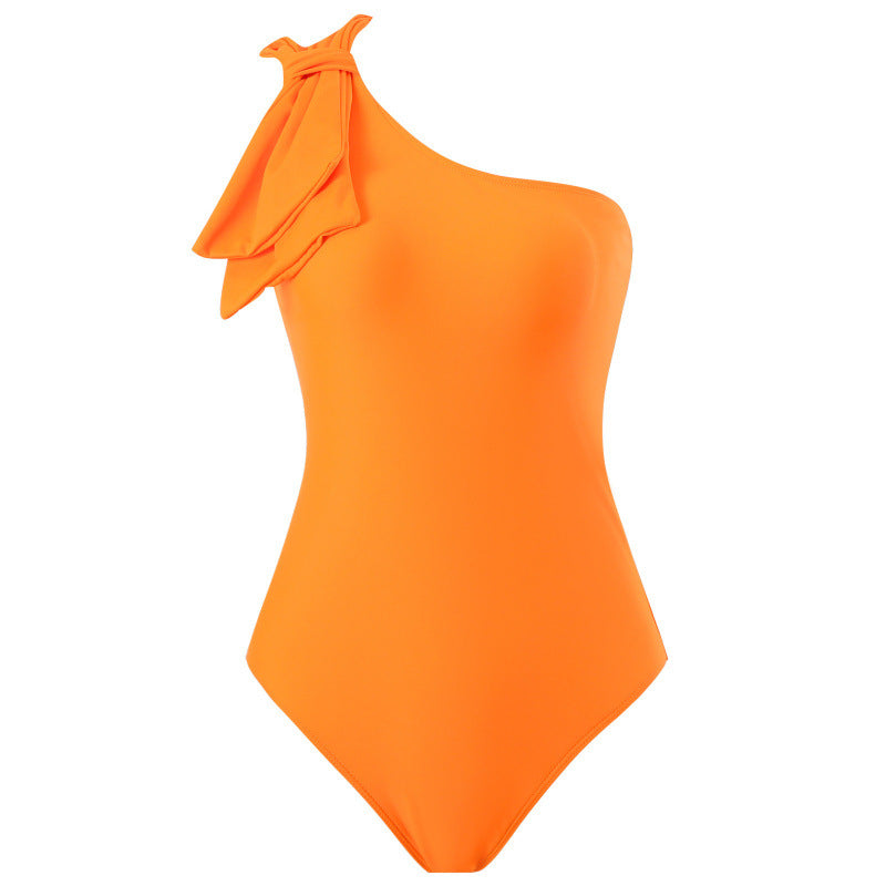 Damen Einteiler Badeanzug mit asymmetrischem Schnitt und modischem Wickelrock Echo Archiv