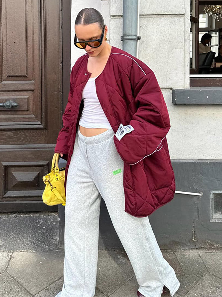 Damen Oversize-Steppjacke mit Diamantstepp, kontrastierender Paspel und Druckknopfverschluss Echoarchiv