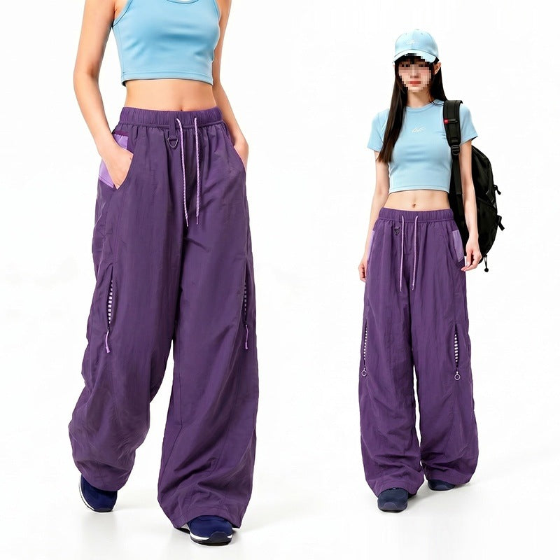 Damen Oversize Tech-Loungehose mit Kontrastnähten, reflektierenden Reißverschlusstaschen & Kordelbund Echoarchiv