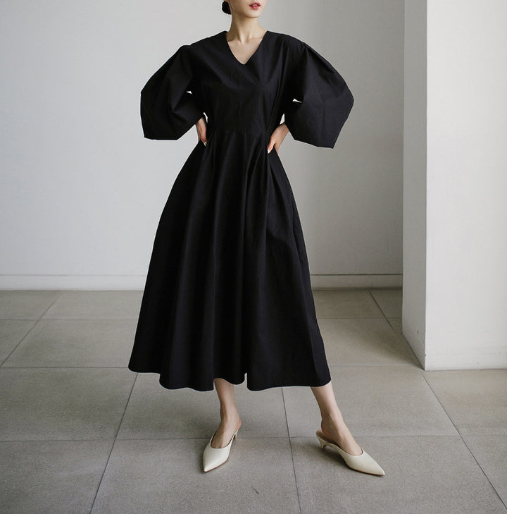 Damen Maxikleid mit weiten Ballonärmeln und seitlichen Eingrifftaschen Echoarchiv