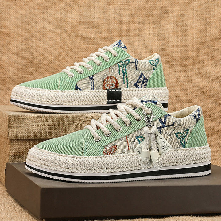 Damen bestickte Canvas‑Sneaker mit Quastenanhänger und geflochtener Plateausohle Echo Archiv