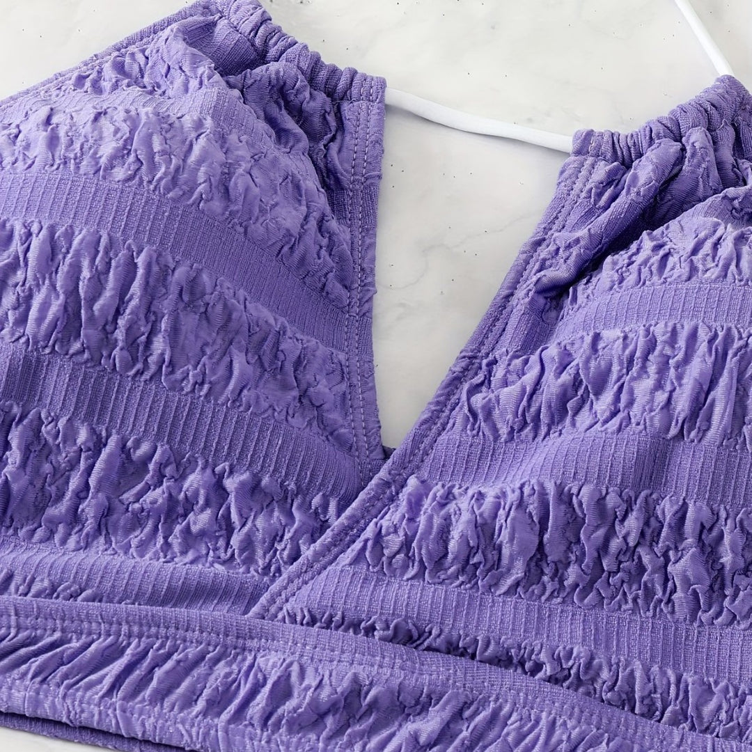 Damen Bikini-Set mit floralem Oberteil und hochglänzenden Shorts Echo Archiv