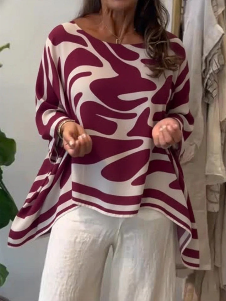 Damen Oversize Sommerbluse mit abstraktem Print, Fledermausärmeln und asymmetrischem Saum – Élovi