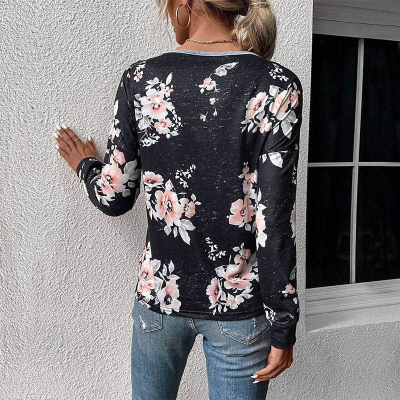 Damen Lässiges Langarm-Jerseyshirt mit kontrastiertem V‑Einsatz, Pompon‑Borte und floralem Alloverprint Echoarchiv