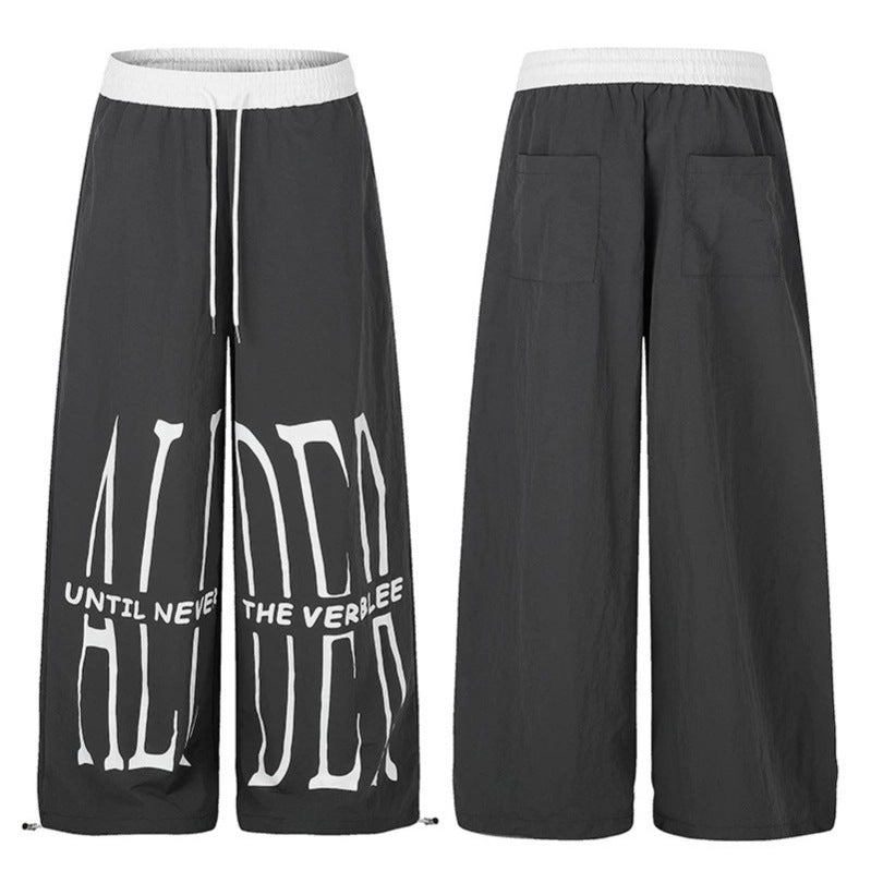 Damen Weite Loungewear-Hose mit hohem Komfortbund, Kordelzug, verstellbarem Saum und typografischem Print Echoarchiv