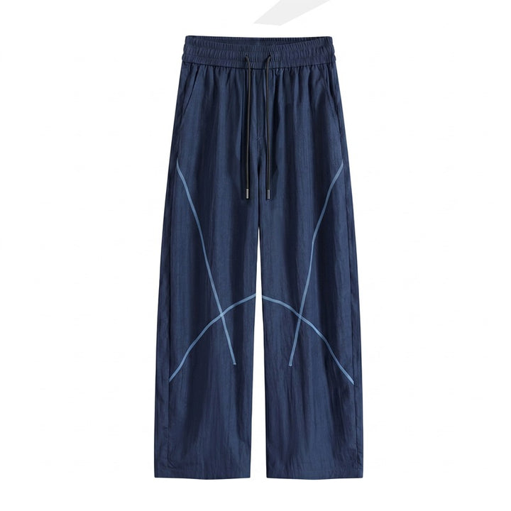 Herren Weite Funktions-Nylonhose mit Kordelbund, reflektierenden Nahtdetails & lässiger Baggy‑Silhouette Echoarchiv