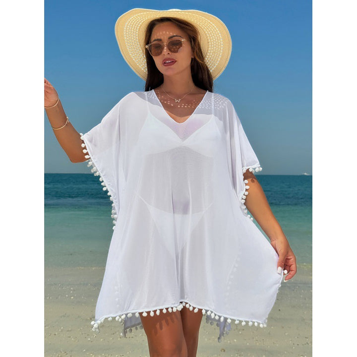 Damen Strandkleid mit dekorativem Pompon-Besatz und elegantem V-Ausschnitt Echo Archiv
