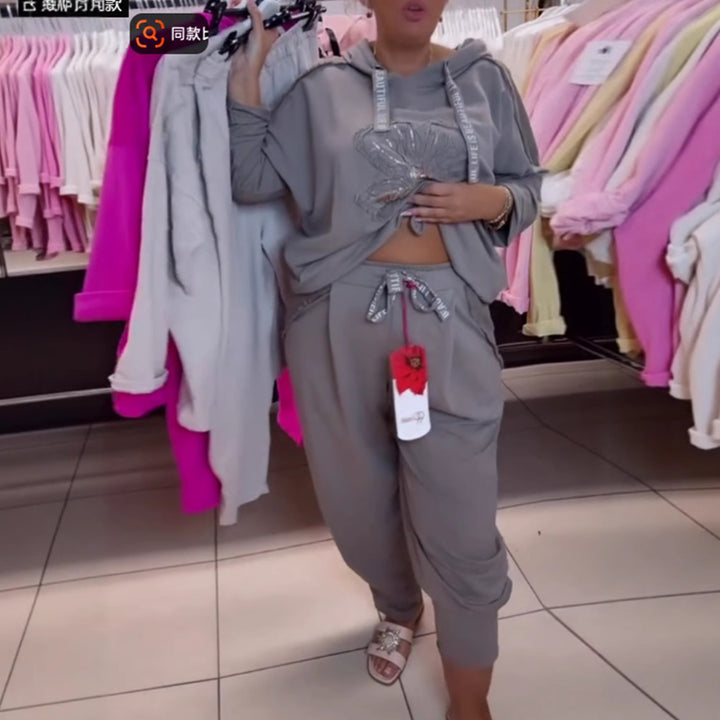 Damen nan entspanntes Lounge-Set mit Blüten-Pailletten-Hoodie, Kordelzug und weiter Bundfaltenhose Echo Archiv