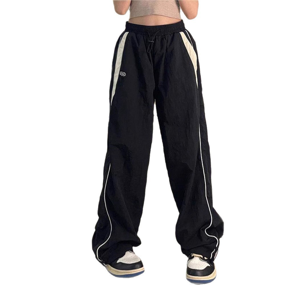 Damen nan weite Trackhose mit Kontrastpaspel, elastischem Bund und Oversize-Schnitt Echo Archiv