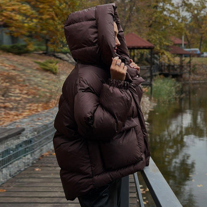 Echoarchiv | Damen Gesteppte Winterjacke mit Oversized Kapuze – Warm, Wasserabweisend & Modern
