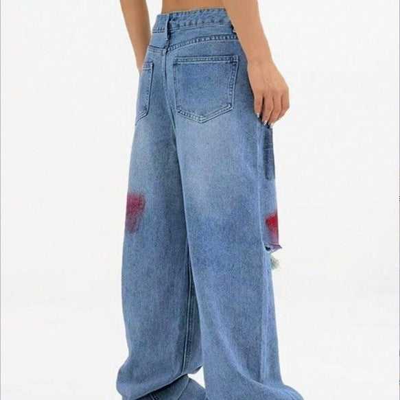 Damen weite Denim-Jeans mit Paint‑Splatter und Distressed-Knie Echo Archiv