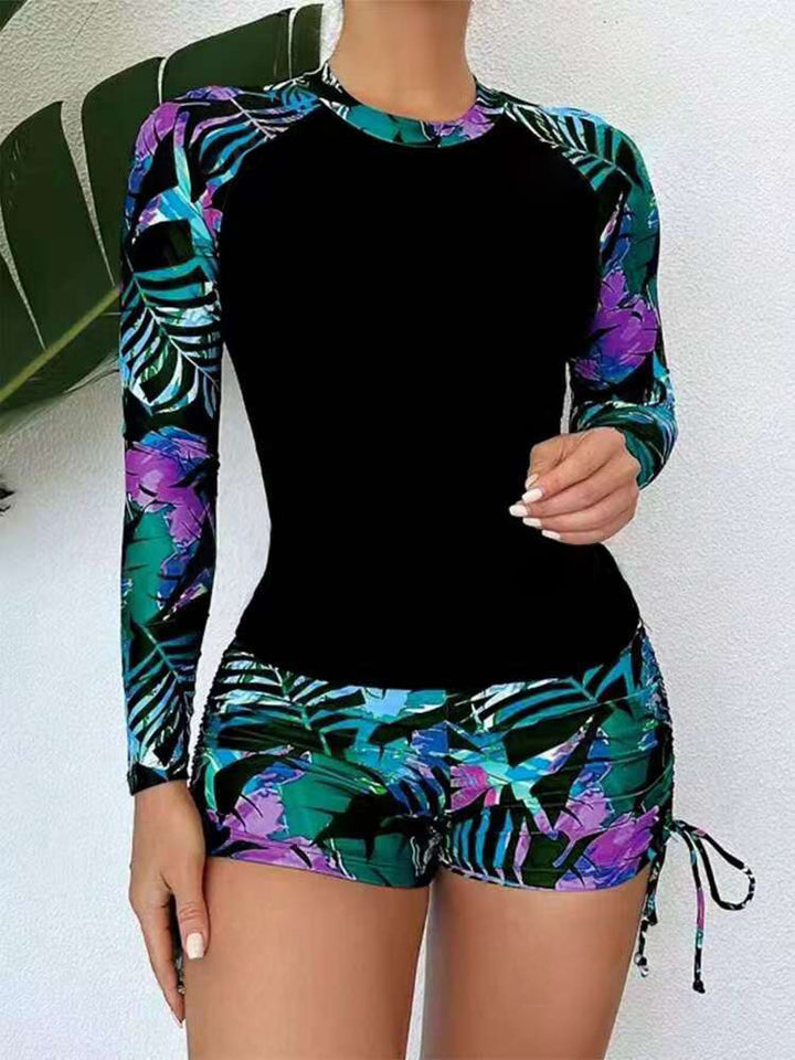 Damen Sport-Rashguard mit kurzen Hosen und farbenfrohem Muster Echo Archiv