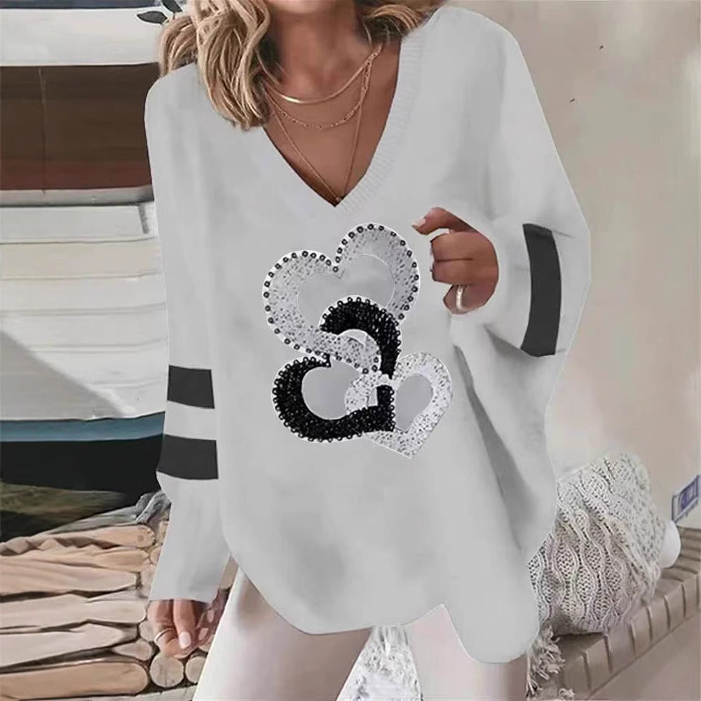 Damen nan übergroßer Strickpullover mit tiefem Ausschnitt Paillettenherz und Kontrastarmstreifen Echo Archiv