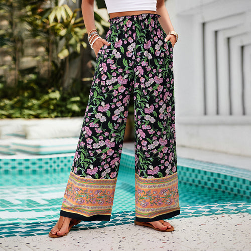 Damen weite Palazzohose mit gerafftem Bund, seitlichen Eingrifftaschen und floraler Boho-Print – Avélisse