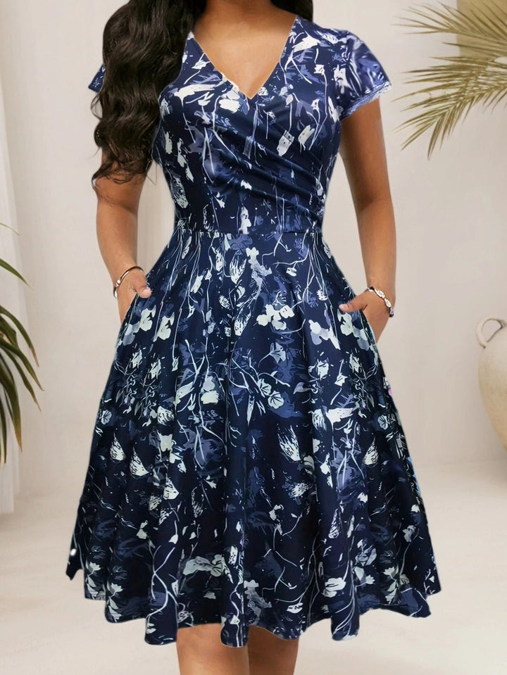 Damen Blumenkleid mit V-Ausschnitt und Taschen Echoarchiv
