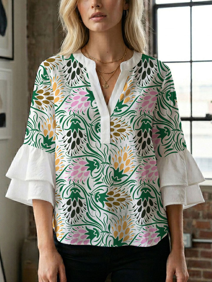 Damen Blusenshirt mit voluminösen Ärmeln und kreativem Druckdesign Echo Archiv
