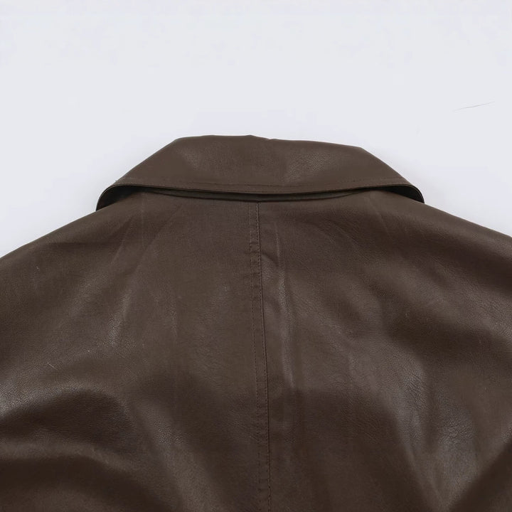 Damen Taillierte Lederoptik-Jacke mit asymmetrischer Knopfleiste und Bindegürtel Echoarchiv