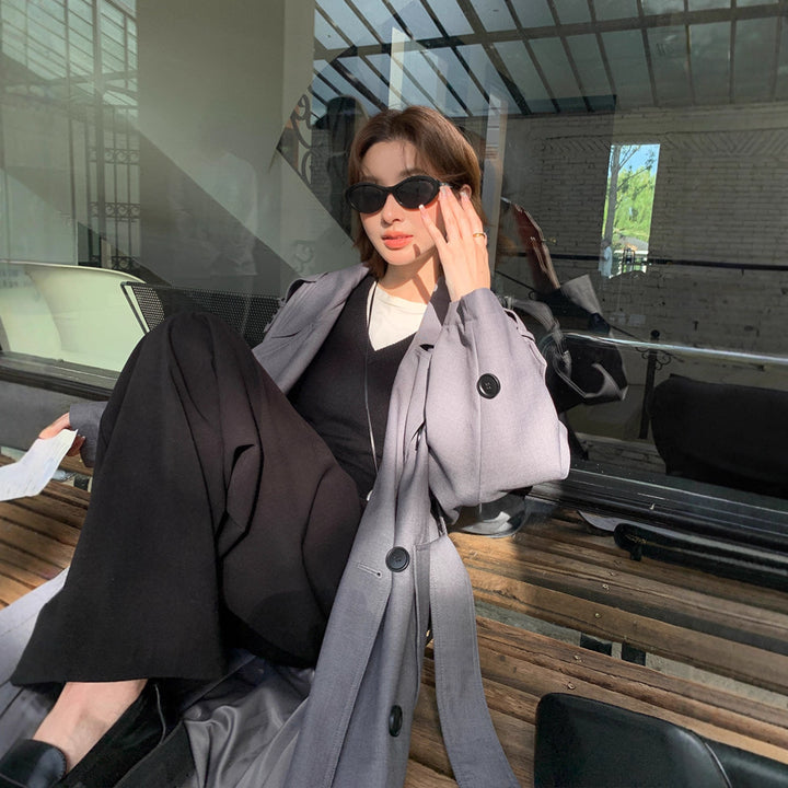 Damen Langer Trenchcoat im Oversize‑Look mit Bindegürtel und Schulterpatten Echoarchiv