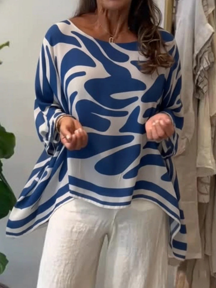 Damen Oversize Sommerbluse mit abstraktem Print, Fledermausärmeln und asymmetrischem Saum – Élovi
