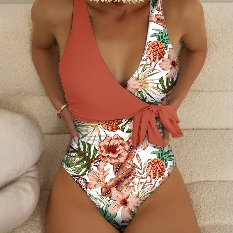 Damen Einteiler Badeanzug mit floralem Wickeldesign und dekorativer Schleife Echo Archiv