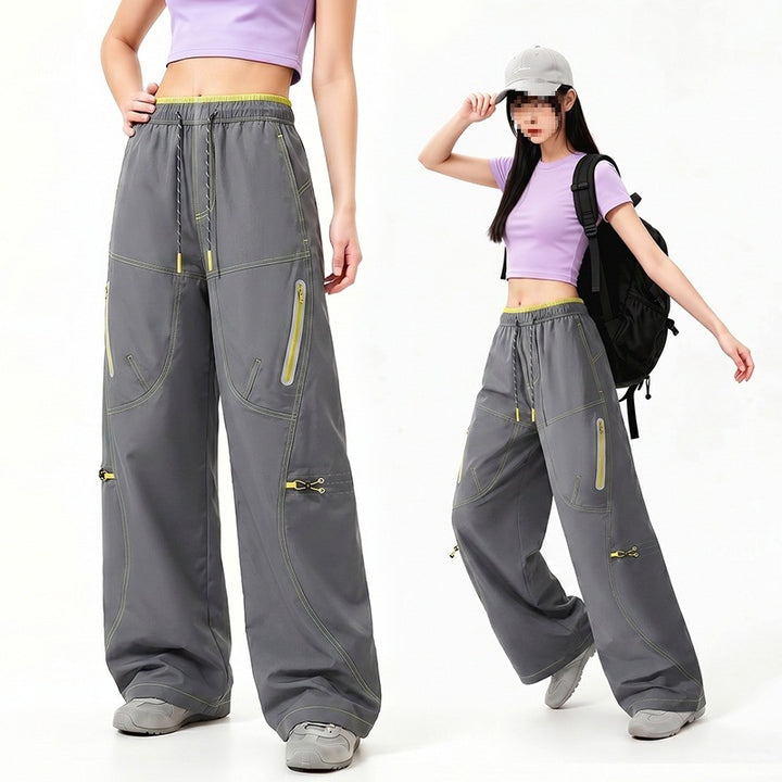 Damen Oversize Tech-Loungehose mit Kontrastnähten, reflektierenden Reißverschlusstaschen & Kordelbund Echoarchiv