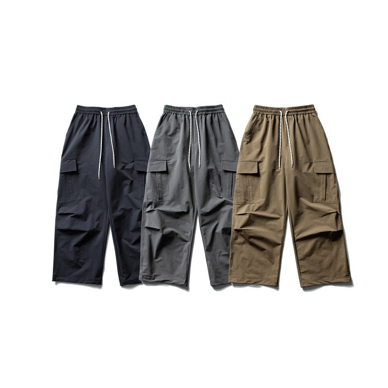 Unisex Weite Cargo-Utility-Hose im Baggy-Schnitt mit elastischem Kordelbund und großzügigen Klappentaschen Echoarchiv