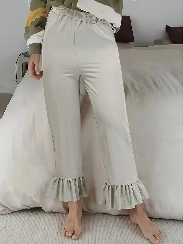 Damen Locker geschnittene Lounge‑Hose aus Jersey mit elastischem Bund und Volant‑Saum – Avélisse