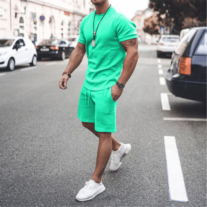 Herren nan figurbetontes Kurzarmshirt mit verstärkter Schulternaht und elastischer Kordelzug-Bermuda aus Stretchjersey Echo Archiv