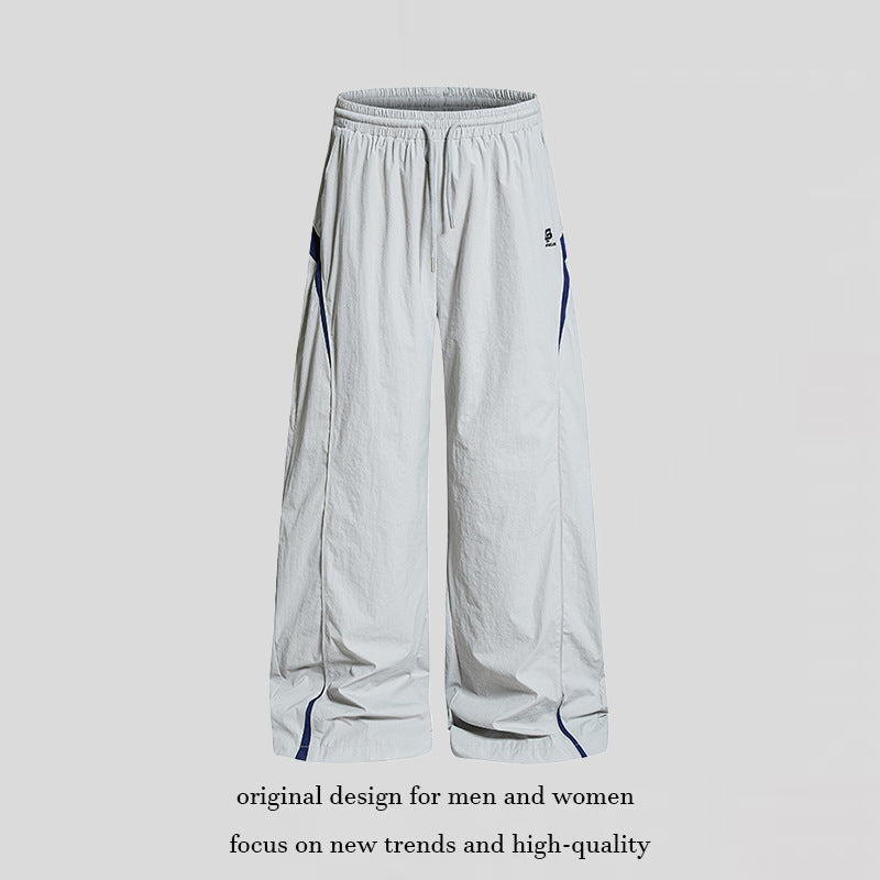 Damen Weite Nylon-Palazzo-Trainingshose mit Tunnelzug, seitlichen Kontrastdreiecken und verstellbarem Saum Echoarchiv