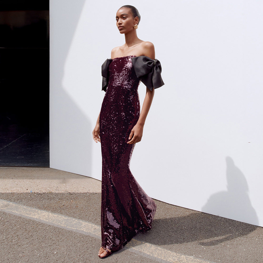 Damen Elegantes Pailletten-Maxikleid mit schulterfreiem Design und dekorativen Schleifen Echo Archiv