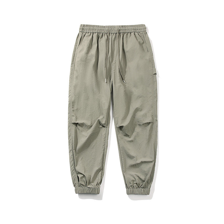 Herren Nylon-Mix Relaxed-Jogger mit elastischem Komfortbund, verdeckten Reißverschlusstaschen und geripptem Knöchelabschluss Echo Archiv