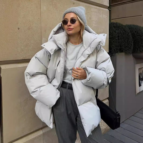 Damen Oversize Steppjacke mit Kapuze und wattierter Thermofüllung Echoarchiv
