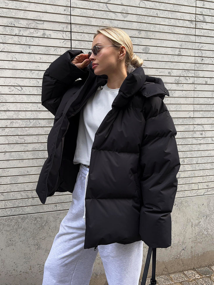 Damen Oversize Steppjacke mit Kapuze und wattierter Thermofüllung Echoarchiv