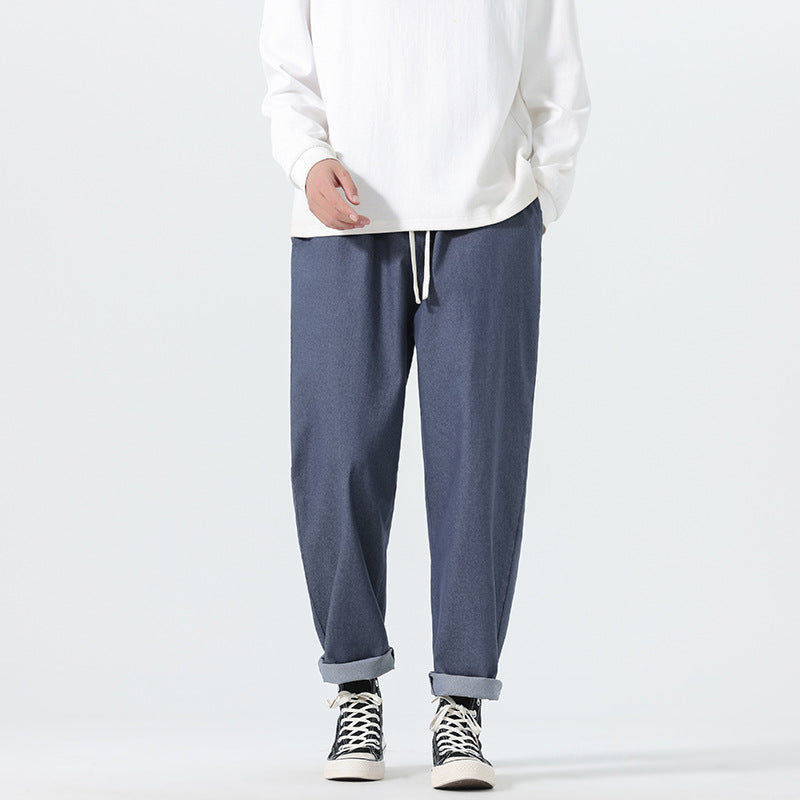 Herren Locker geschnittene Cropped-Denimhose mit Umschlag und Label-Patch Echo Archiv