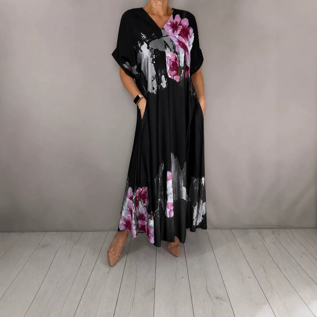 Damen Maxikleid mit weitem Fall, V-Ausschnitt, Eingrifftaschen und floraler Aquarelloptik Echoarchiv