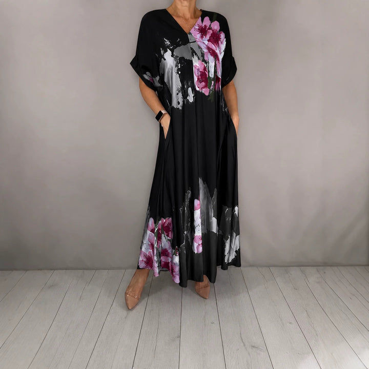 Damen Maxikleid mit weitem Fall, V-Ausschnitt, Eingrifftaschen und floraler Aquarelloptik Echoarchiv