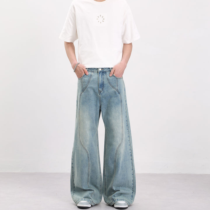 Herren Weit geschnittene Denim-Palazzohose mit geschwungenen Nahtpaneelen und extralangem Saum Echo Archiv