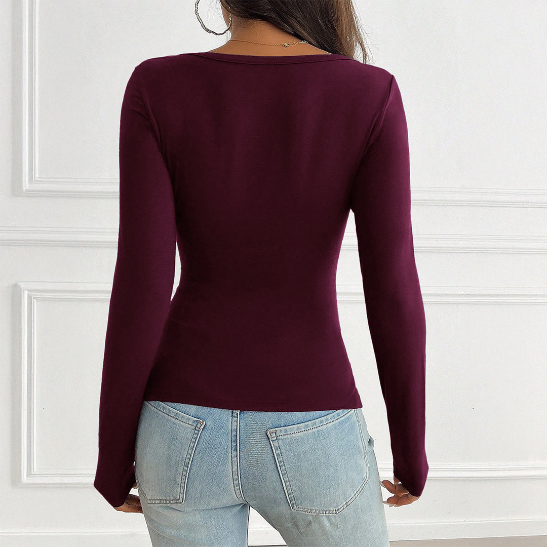 Damen tailliertes Langarmshirt mit geraffter Knopfleiste und tiefem V-Ausschnitt – Maréline