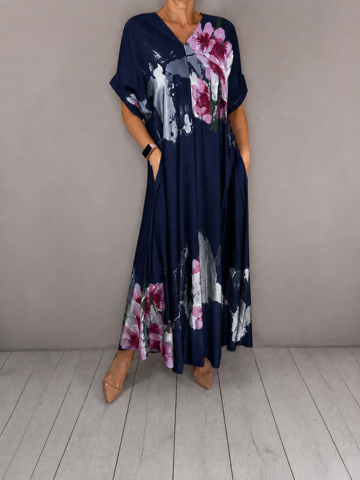 Damen Maxikleid mit weitem Fall, V-Ausschnitt, Eingrifftaschen und floraler Aquarelloptik Echoarchiv