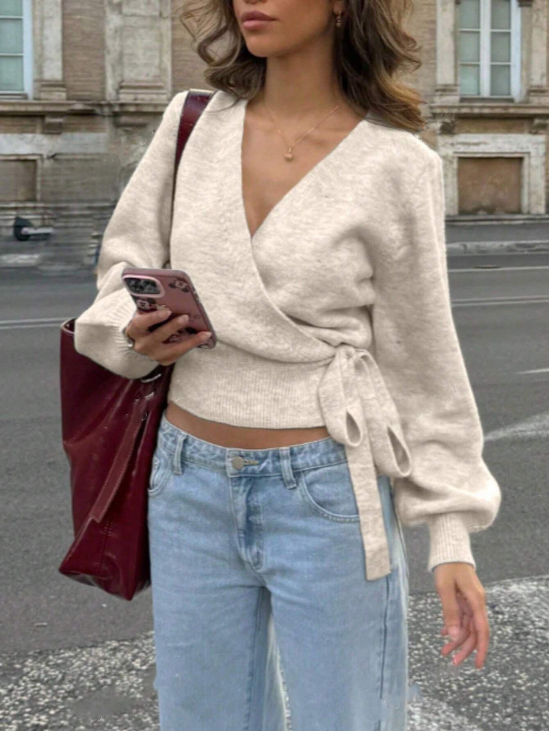 Damen Wickel-Strickpullover mit V-Ausschnitt, Bindegürtel und Ballonärmeln Echoarchiv