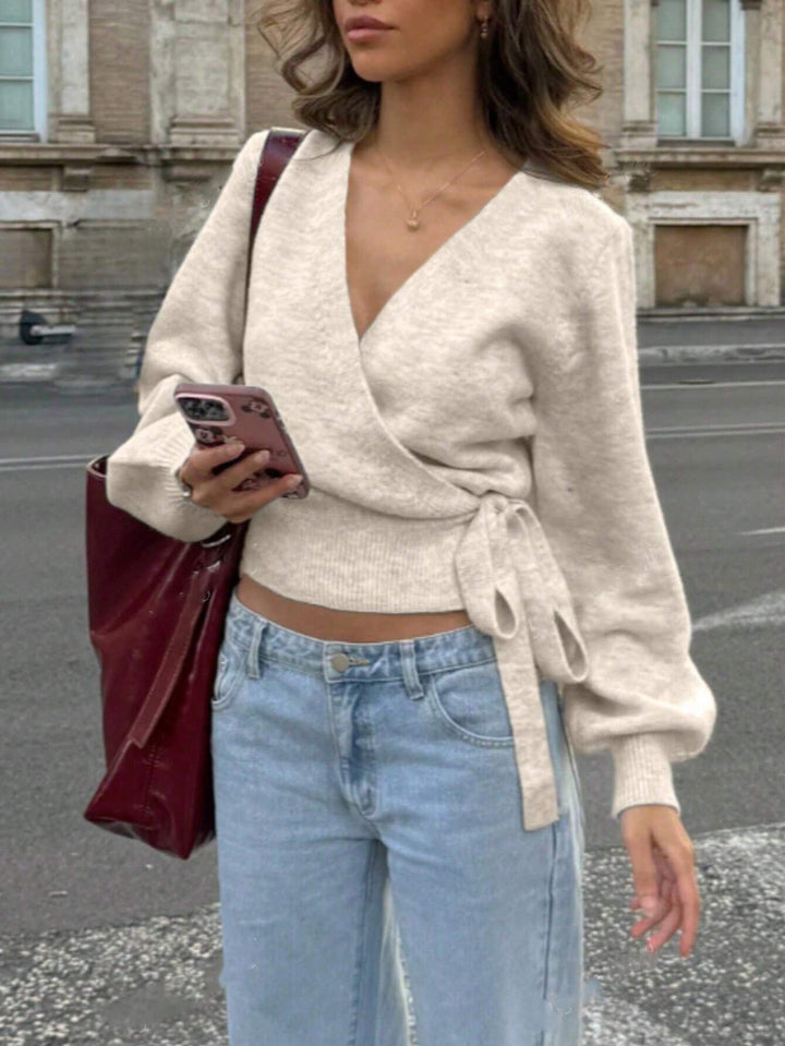 Damen Wickel-Strickpullover mit V-Ausschnitt, Bindegürtel und Ballonärmeln Echoarchiv