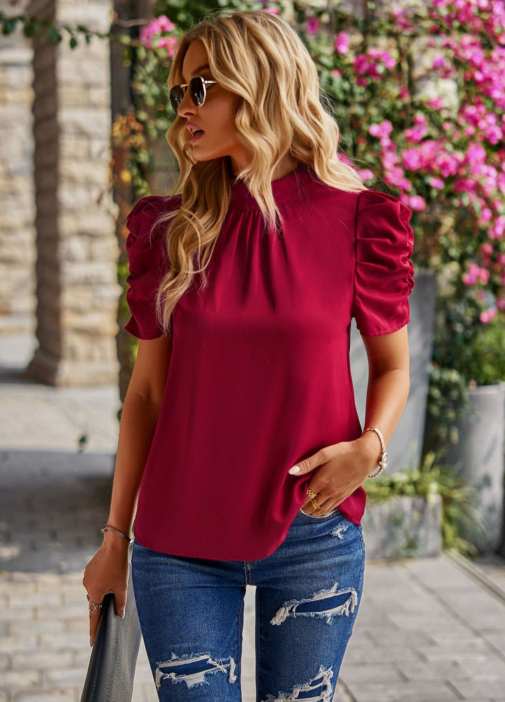 Damen Elegantes Oberteil mit Puffärmeln und subtilen Rüschendetails Echo Archiv