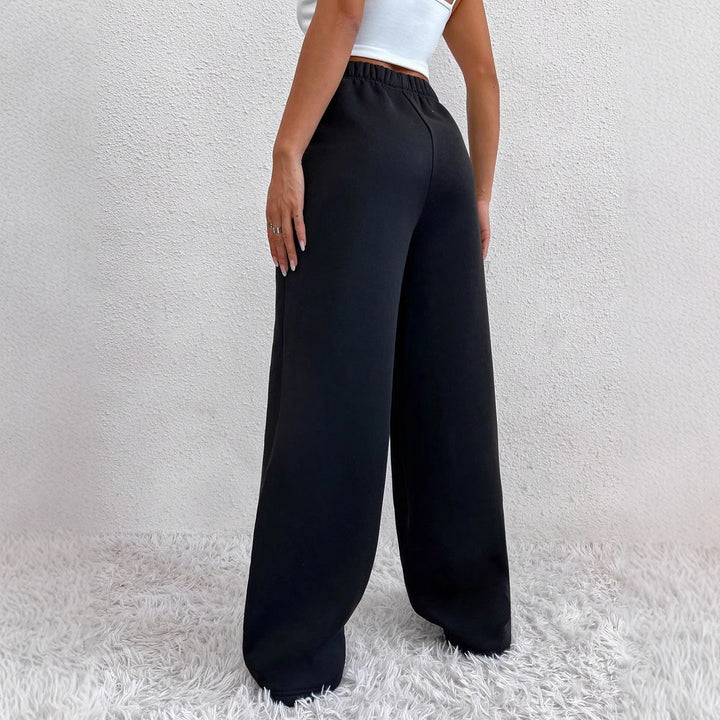 Damen weite Loungehose aus French Terry mit hohem Komfortbund, seitlichen Eingrifftaschen und fließendem Bein – Avélisse