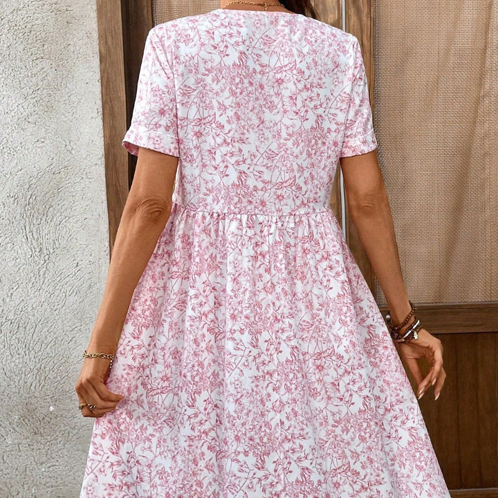 Damen Sommerliches Kleid mit floralem Muster und V-Ausschnitt Echo Archiv