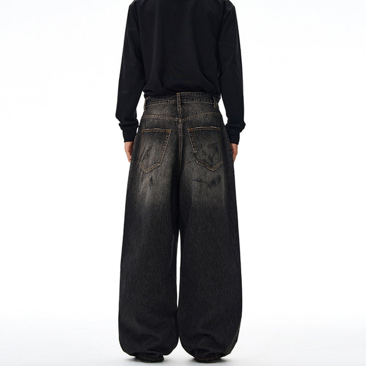 Herren Weit geschnittene Denim-Hose im bodenlangen Baggy-Stil mit dezenter Paint-Splatter-Optik Echo Archiv